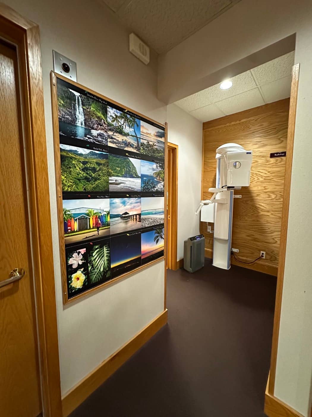 The imaging alcove beside a wall of Hawaii photos